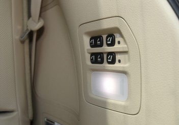 Third row seats are electrically operated with these buttons near the tailgate.