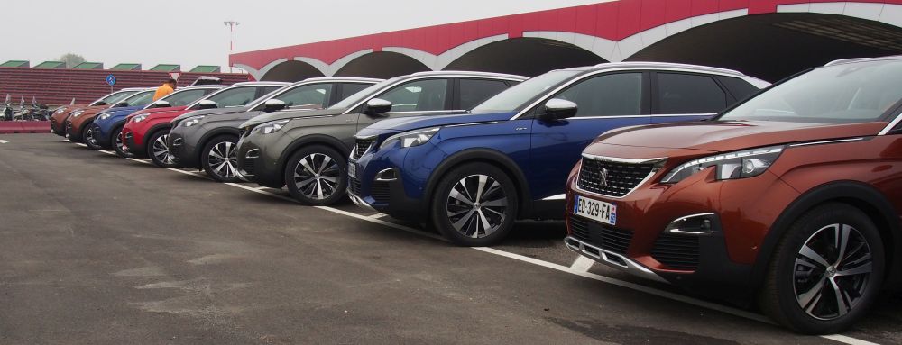 Peugeot 3008s waiting to be driven off at the Bologna airport at the start of the journey.