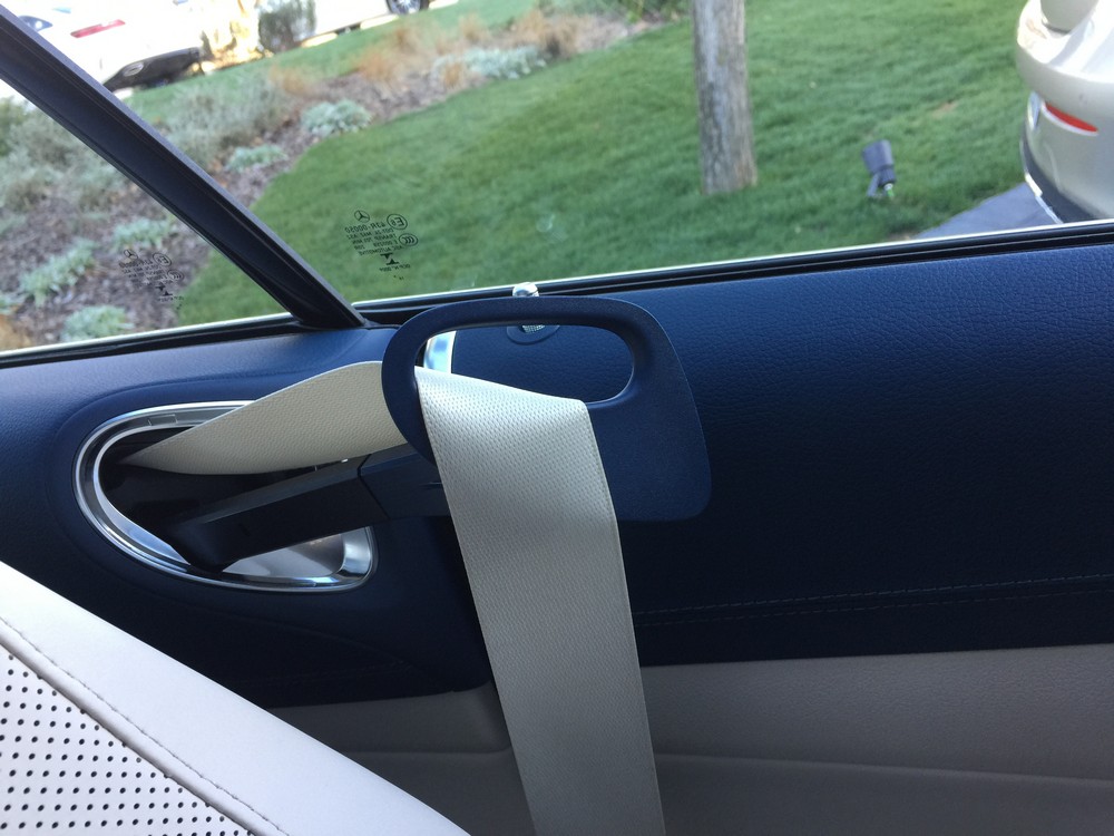 Sit in. shut the door and the coupe hands you the seatbelt.