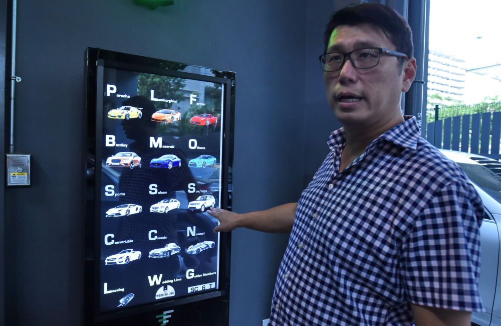 Hong operates AutoBahn Motors. - AFP